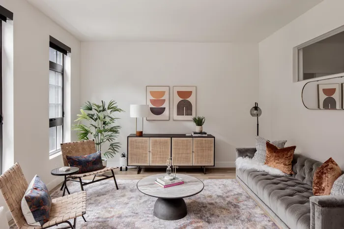 living room with furniture and natural light from large window modera art park apartment homes for rent in denver colorado