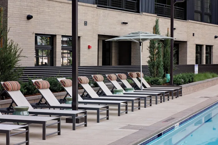 sundeck with lounge seating lined up in a row modera art park apartment homes for rent in denver colorado