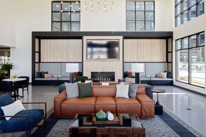 hdtv surrounded by seating in clubhouse modera art park apartment homes for rent in denver colorado
