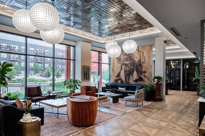 lobby area with decorative lighting and seating modera art park apartment homes for rent in denver colorado