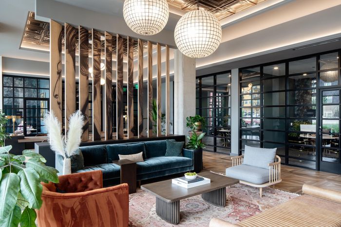 lobby area with decorative lighting and seating modera art park apartment homes for rent in denver colorado