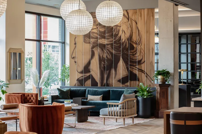 decorative dividing wall in lobby with seating modera art park apartment homes for rent in denver colorado