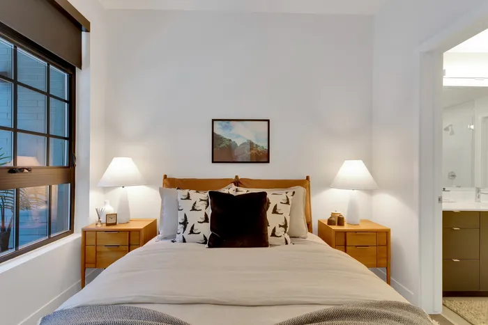 large bedroom with trendy light wood furniture modera art park apartment homes for rent in denver colorado