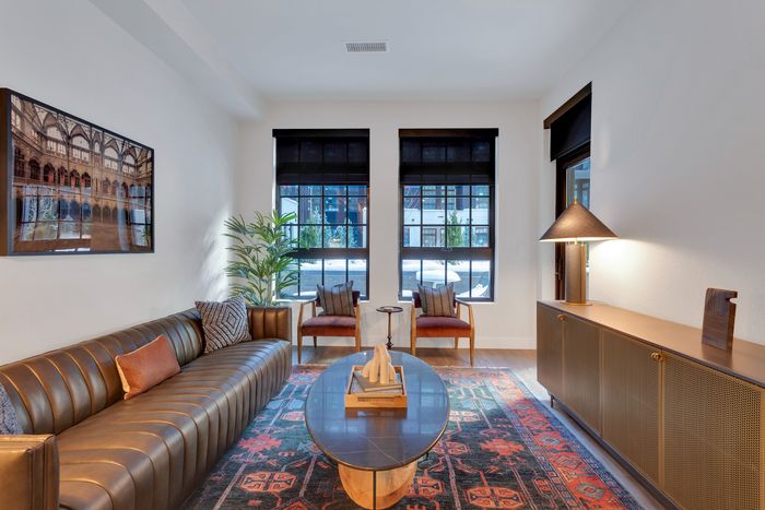 living room with large windows allowing for natural light modera art park apartment homes for rent in denver colorado