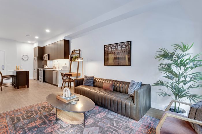 living area with open floor plan and high ceilings modera art park apartment homes for rent in denver colorado