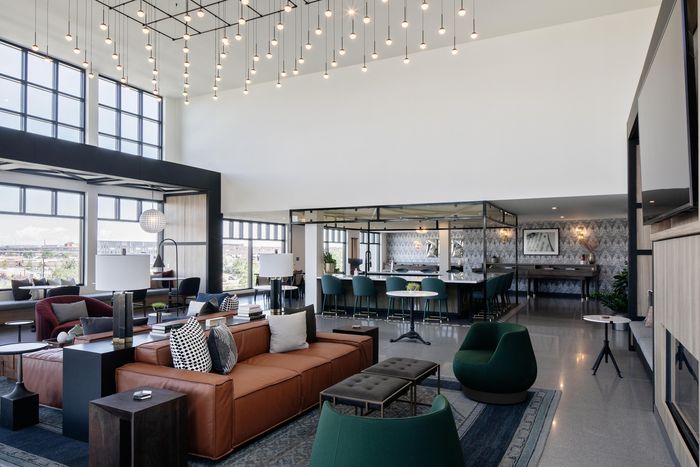 clubhouse with seating and co-working space modera art park apartment homes for rent in denver colorado