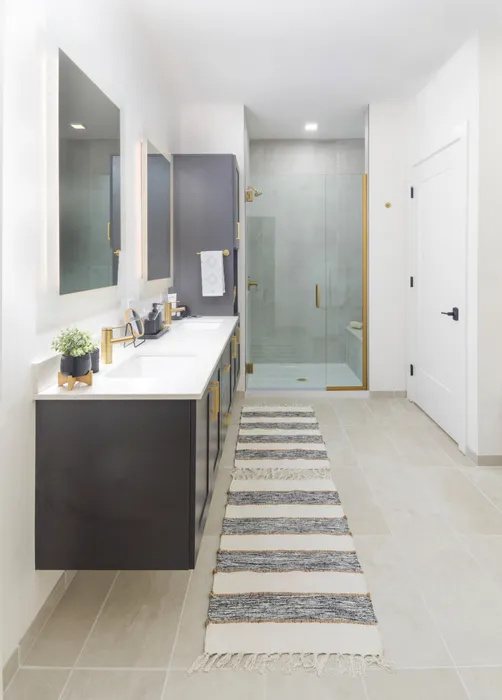 double vanity bathroom with glass enclosed shower modera cherry creek apartment homes for rent in denver colorado
