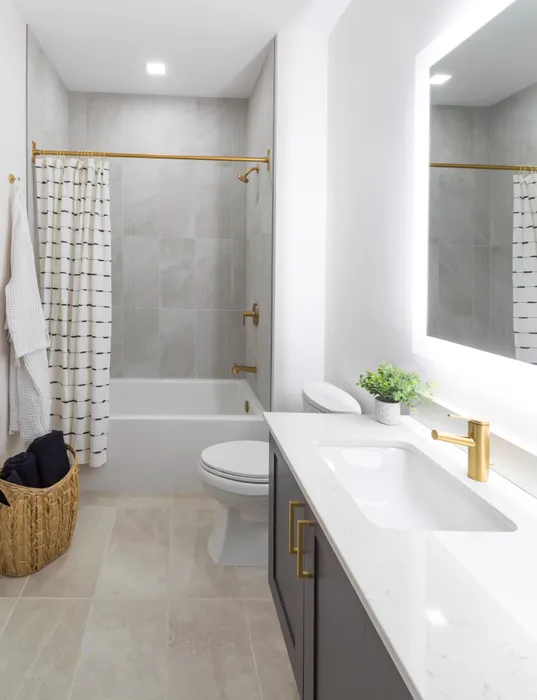 bathroom with bathtub and backlit mirror modera cherry creek apartment homes for rent in denver colorado