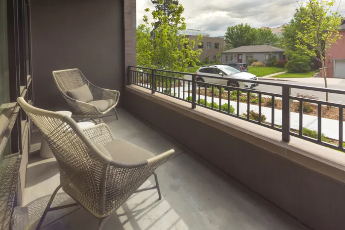balcony with two chairs and view of neighborhood modera cherry creek apartment homes for rent in denver colorado