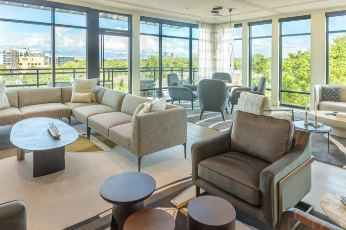 clubhouse with seating and balcony with green views modera cherry creek apartment homes for rent in denver colorado