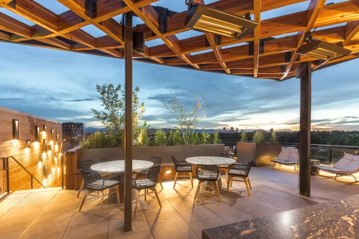 outdoor dining and seating space with covering modera cherry creek apartment homes for rent in denver colorado