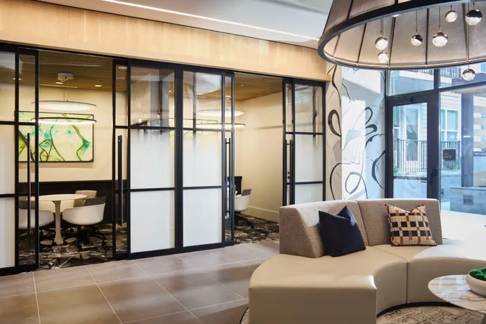 conference rooms and coworking space with ample seating at modera clarendon apartment homes for rent in arlington va