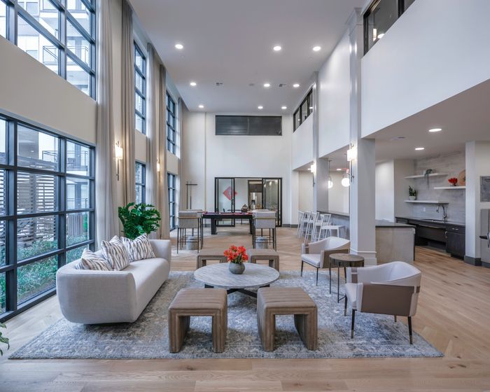 lounge seating in clubroom at modera six pines apartment homes for rent in shenandoah texas