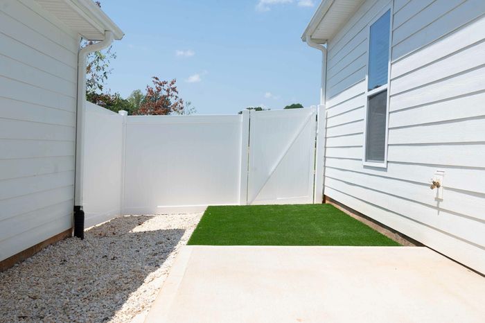 Private turf fenced in backyard at Amavi homes in Sherrills Ford