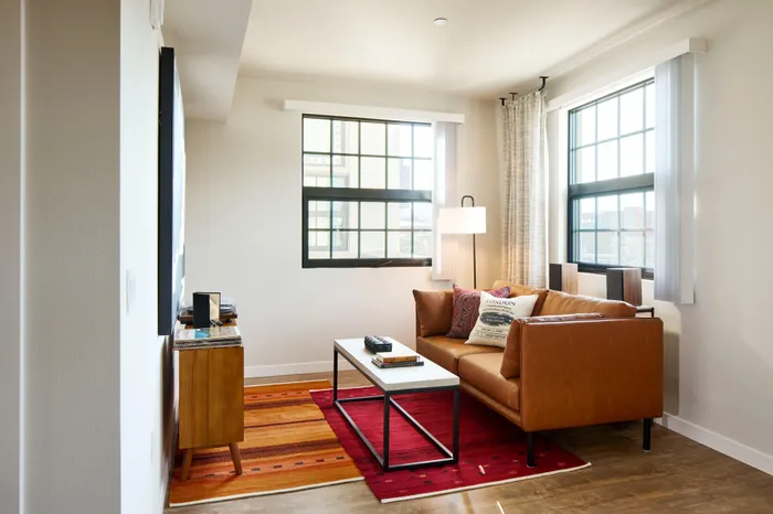 living area with multiple windows Modera Berkeley, CA apartment.