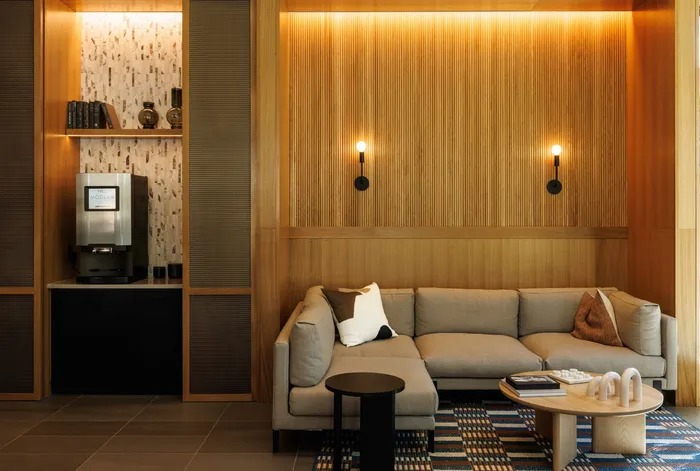 beautiful lounge space in clubroom with coffee bar and comfortable seating