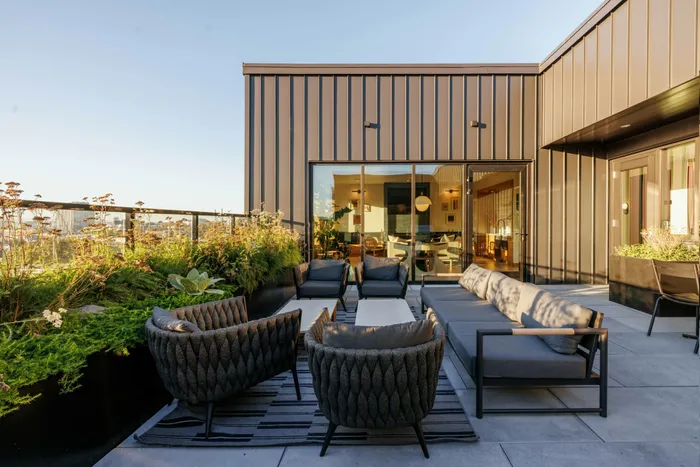 comfortable seating on rooftop lounge with sweeping views
