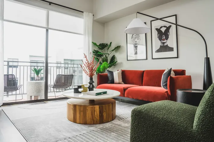 living room with oversize windows and city views
