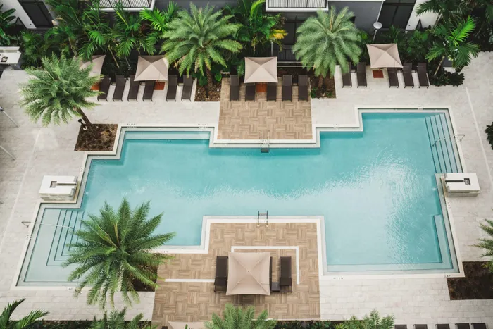aerial view of uniquely shaped pool at modera coral springs