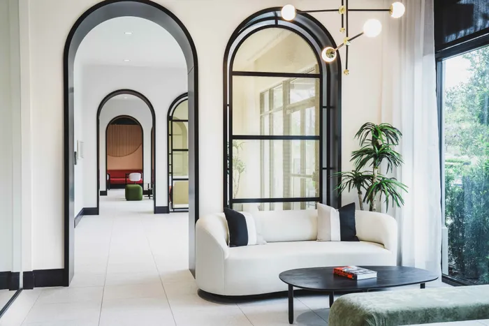spa-like community rooms with luxury seating, large arched doorways and modern finishes