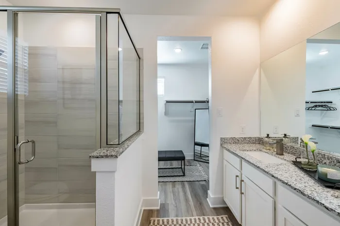 bathroom with glass enclosed shower at amavi celina single family homes for rent in texas