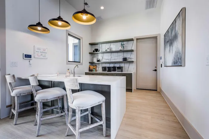 Clubhouse interior with coffee shop style seating for working and hosting