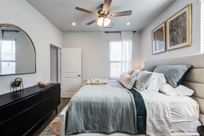 bedroom with furniture and large window amavi sherrils ford