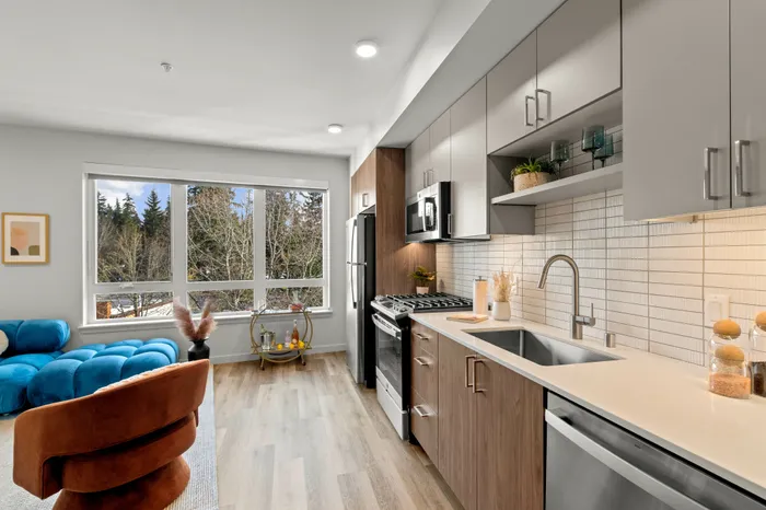 kitchen looking towards large windows at modera overlake apartment homes for rent in WA