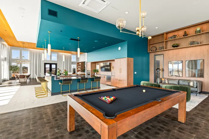 resident clubroom with demonstration kitchen and games at modera overlake apartment homes for rent in wa