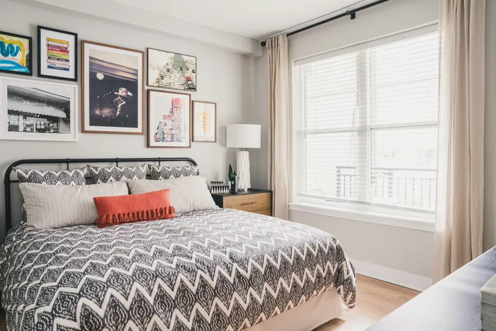 large spacious bedroom with large windows boasting tons of natural light