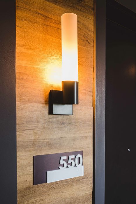 entrance to apartment with cozy lighting and black door
