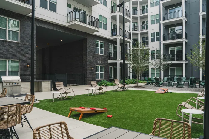 courtyard area with luscious green grass and seating areas