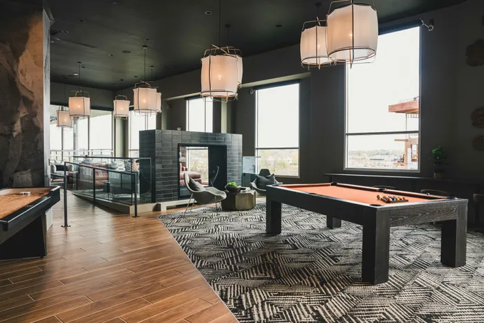 clubroom with cozy seating and pool tables