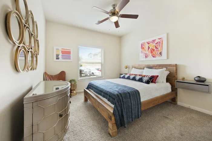spacious bedroom with ceiling fans