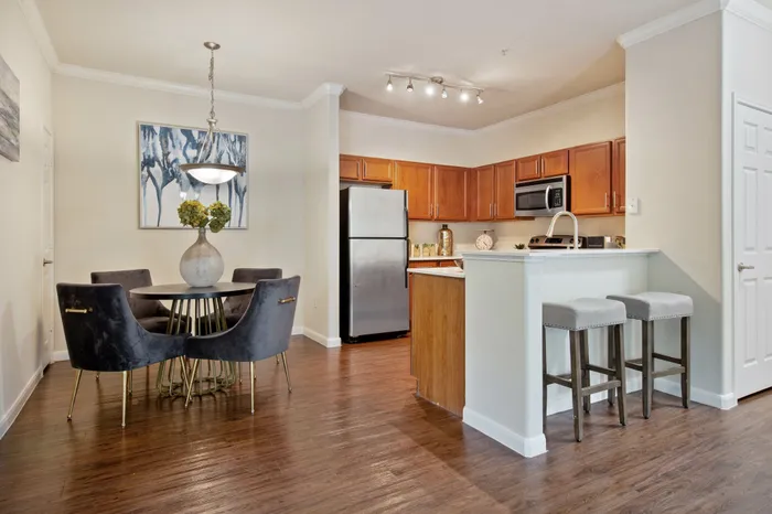 kitchen with wood tones cabinetry and hardwood style flooring