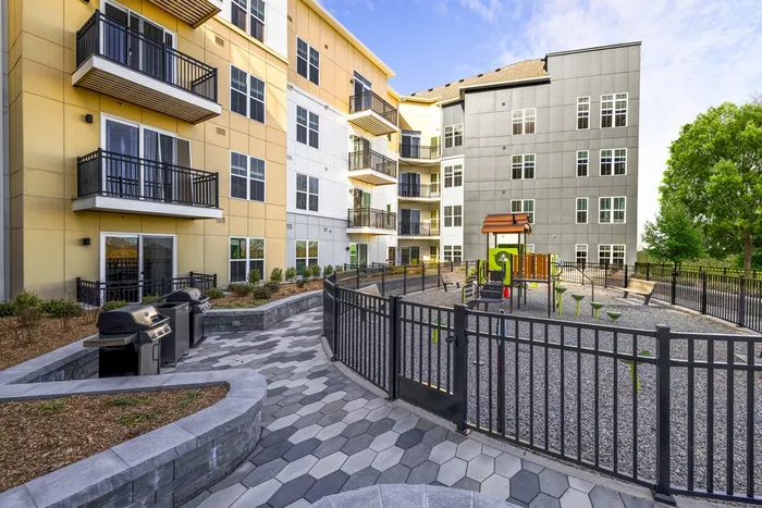 courtyard and private patios overlooking playground and grilling area
