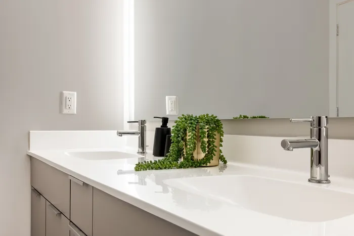 gourmet bathroom with quartz countertops and large vanity