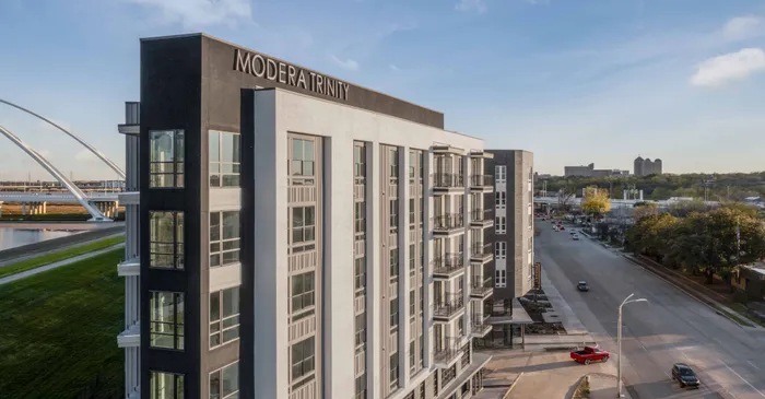 whole view of building at Modera Trinity apartments with views of downtown Dallas