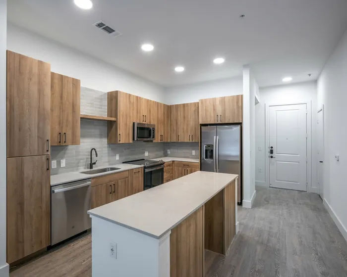 Kitchen with stainless steel appliances and quartz countertops