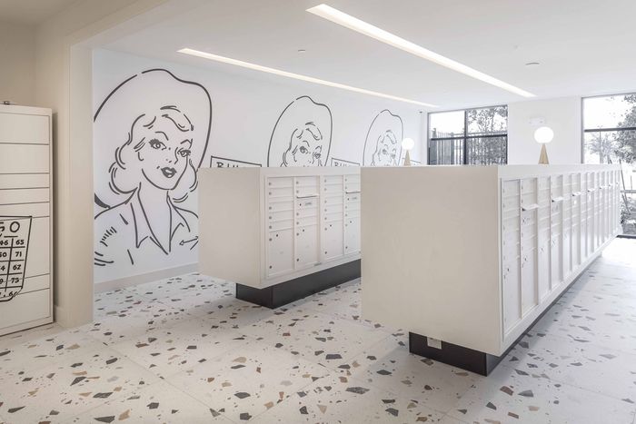 convenient package room with white mail boxes
