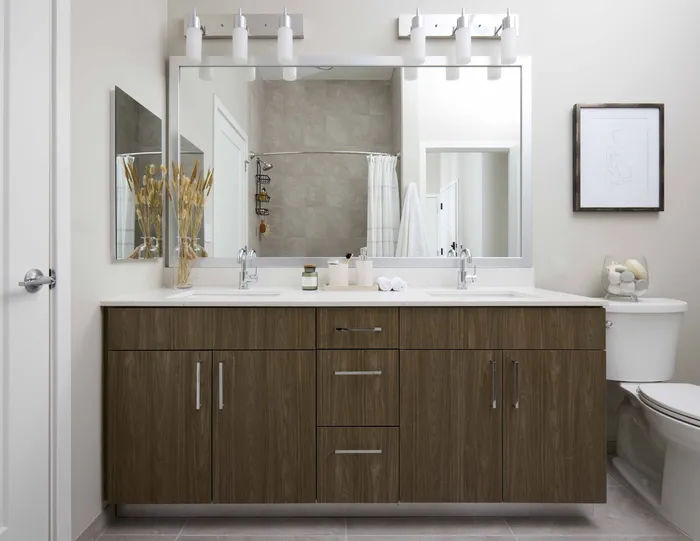 serene bathrooms with backlit mirrors and spacious vanities