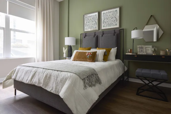 large bedrooms with ceiling fans and hardwood style flooring