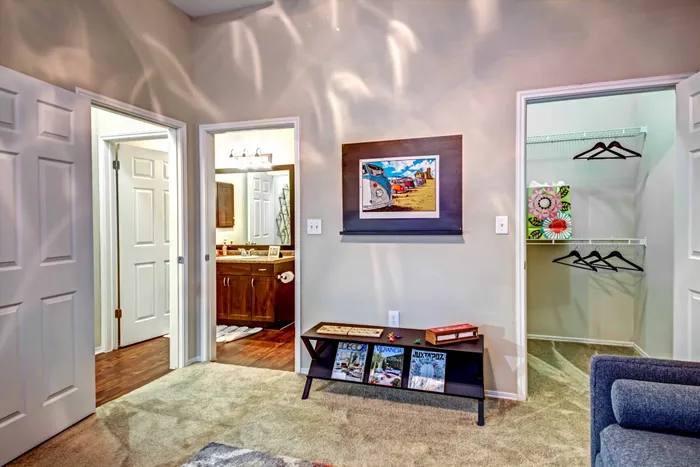 bedroom lookiing onto closet and bathroom spaces alister sunset valley apartment homes for rent in austin tx