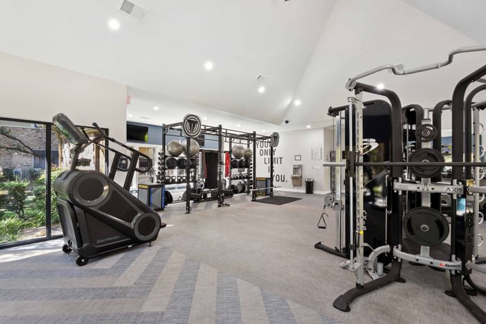 fitness center with weights and cardio alister sunset valley apartment homes for rent in austin tx