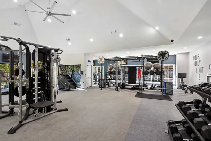 fitness center with weight rack and high end equipment alister sunset valley apartment homes for rent in austin tx
