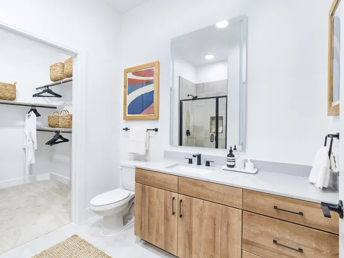 high end bathroom with large closet modera trinity apartment homes for rent in tx