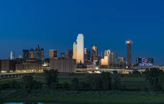 city skyline view from apartment community modera trinity homes for rent in tx