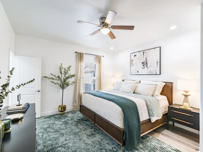 large bedroom with ceiling fan and oversized window at amavi aster ridge single family homes for rent in phoenix az
