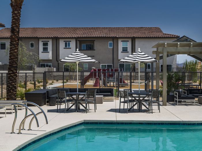 summer day pool with blue water and sundeck at amavi aster ridge single family homes for rent in phoenix az
