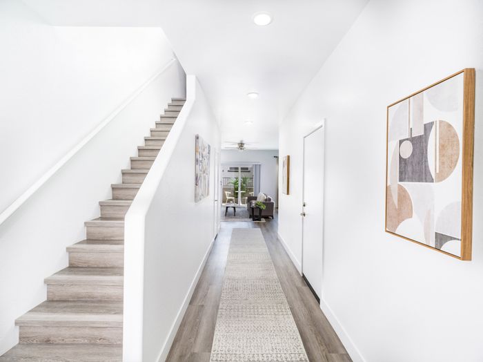 stairs from entrance of home looking into hallway at amavi aster ridge single family homes for rent in phoenix az
